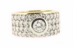 18ct two tone bezel set Engagement ring featuring a wide four row Diamond set band