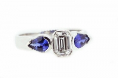18ct White Gold ring featuring an emerald cut Diamond and pear cut Sapphires